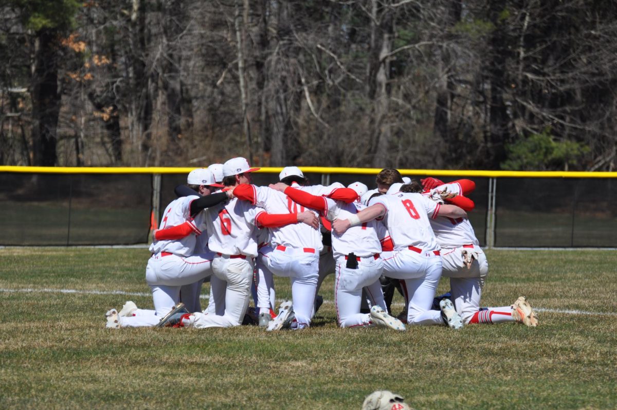 Masco+Huddles+as+a+Team+Prior+to+First+Game+Against+Methuen