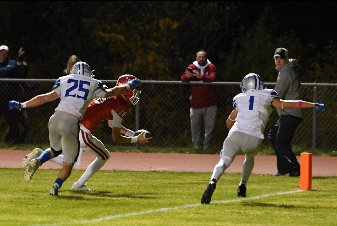 Masco quarterback Drew Gustafson diving for the touchdown