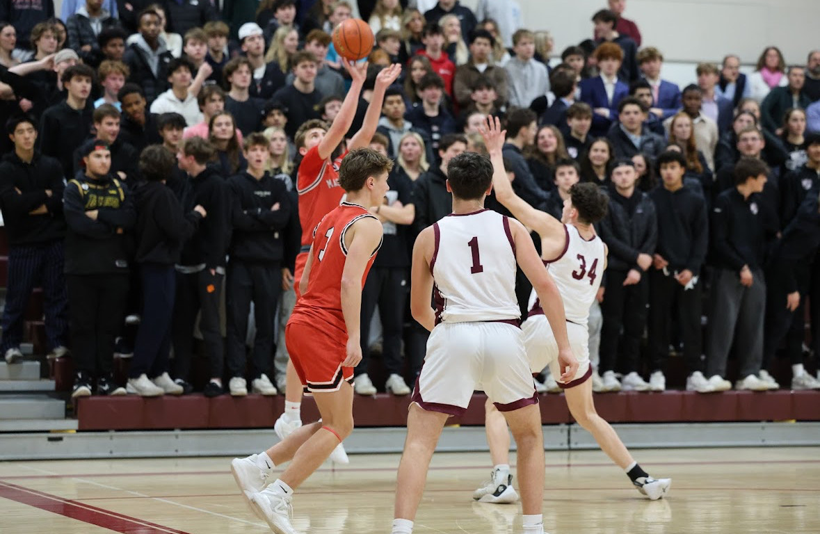 Masco's Jimmy Farrell shooting in front of a packed student section