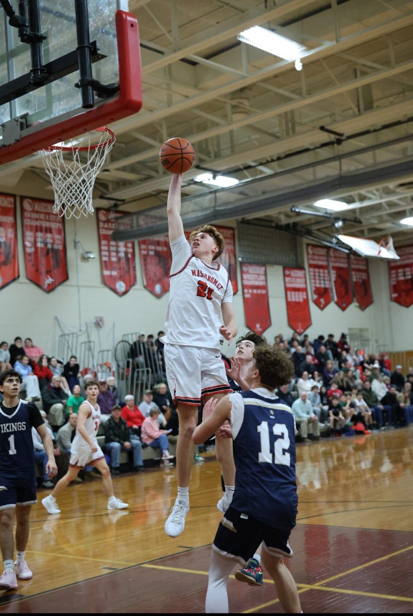 Masco's Denton flying up for the one-hand punch 