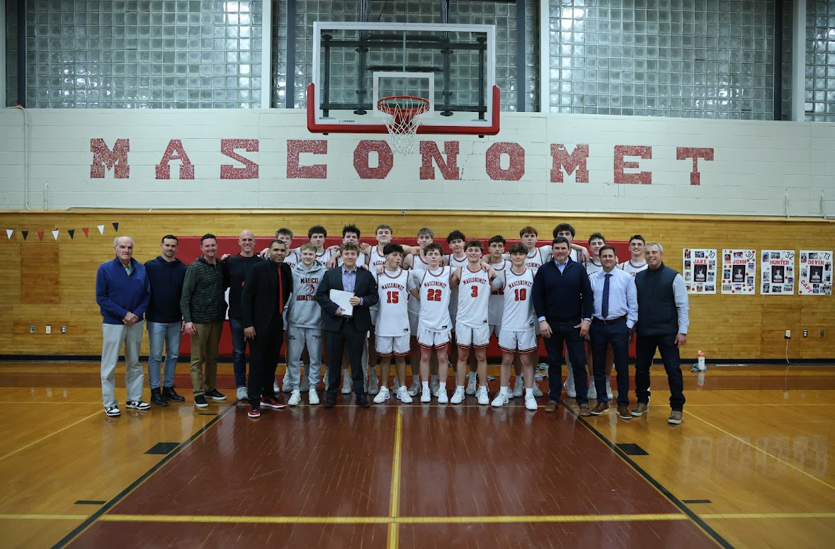 The current Masco team taking a picture with Masco boys team of '97 as both won their division.