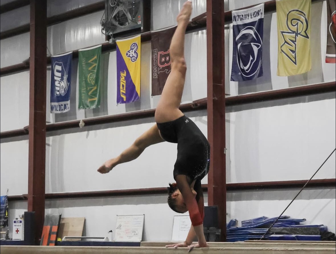 Senior Kate Mugge during her beam routine.